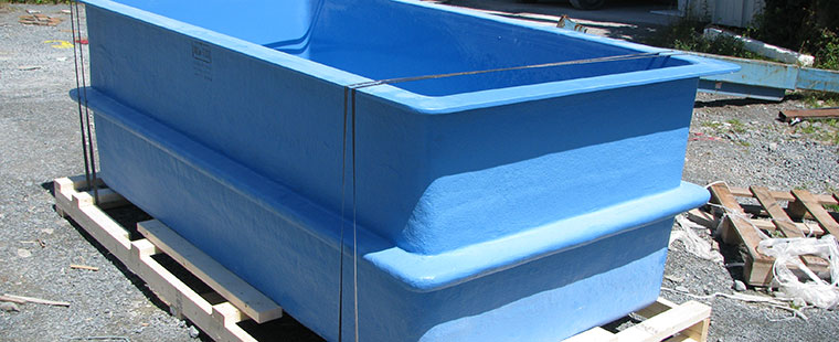 Dura-Tech blue fiberglass rectangular tank on wooden pallet ready for delivery