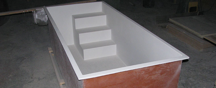 Dura-Tech fiberglass rectangular tank with integrated steps in manufacturing facility