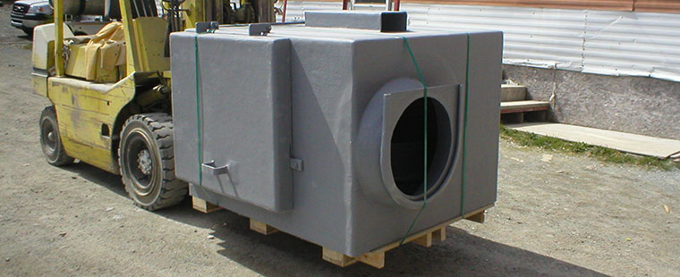 Dura-Tech custom fiberglass utility enclosure on pallet with forklift at manufacturing facility