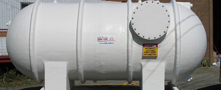 Dura-Tech white fiberglass horizontal saddle tank with access port and safety warning label