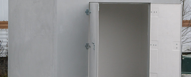 Dura-Tech fiberglass utility enclosure with open door showing interior compartment