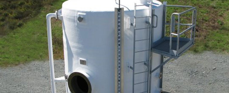 Dura-Tech fiberglass vertical storage tank with ladder access and safety platform for industrial applications
