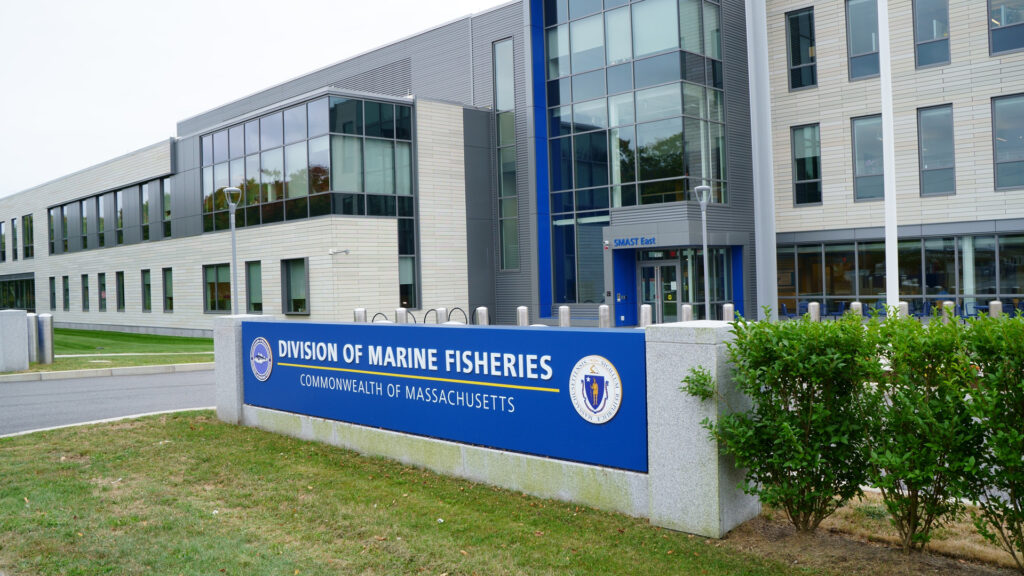 Division of Marine Fisheries building entrance with blue signage and modern aquaculture research facility